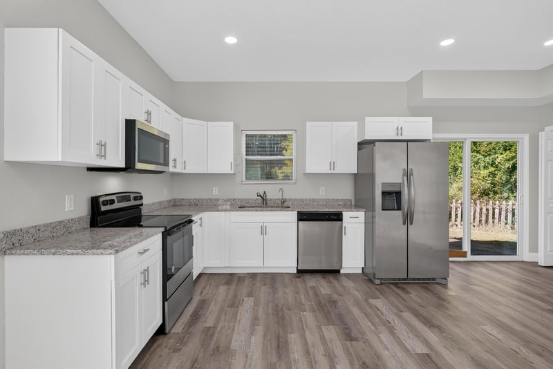 Kitchen with white cabinetry, photographed by Megapixeler on Lem Turner Rd, Jacksonville