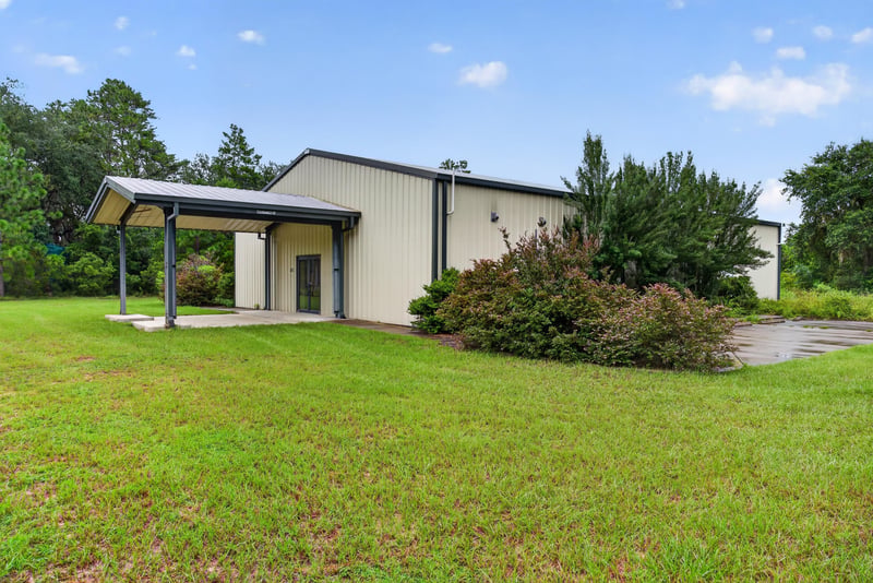 Exterior of the second building with covered entry at 1038 County Rd 315, Melrose