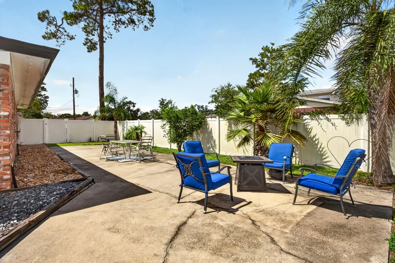 Patio area with palm trees and outdoor seating at 6059 Karen St, Jacksonville, FL 32244