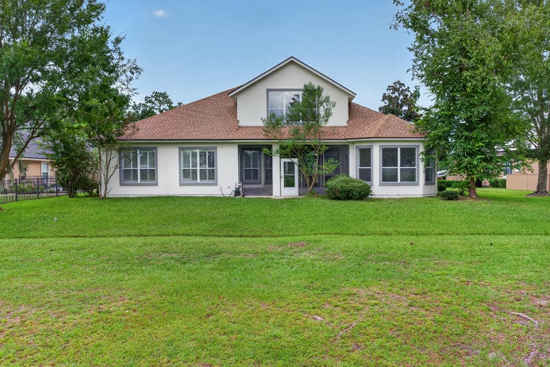 Rear exterior with open lawn at 4109 Eagle Landing Pkwy, Orange Park, FL 32065