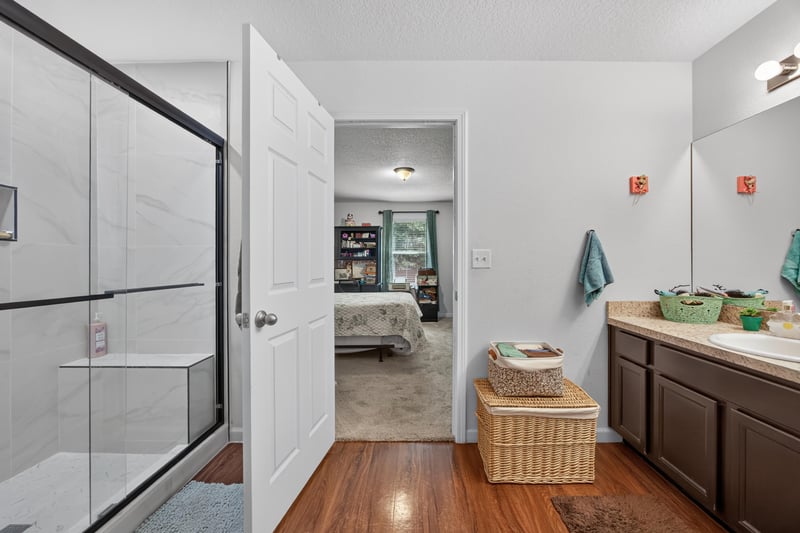 Primary bathroom with walk-in closet entry at 518 Matecumbe Ct, Macclenny, FL