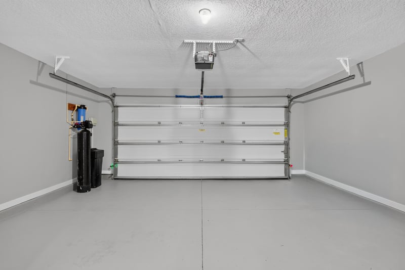 Garage with water heater and softener at 706 Grampian Highlands Dr, St. Johns, FL 32259