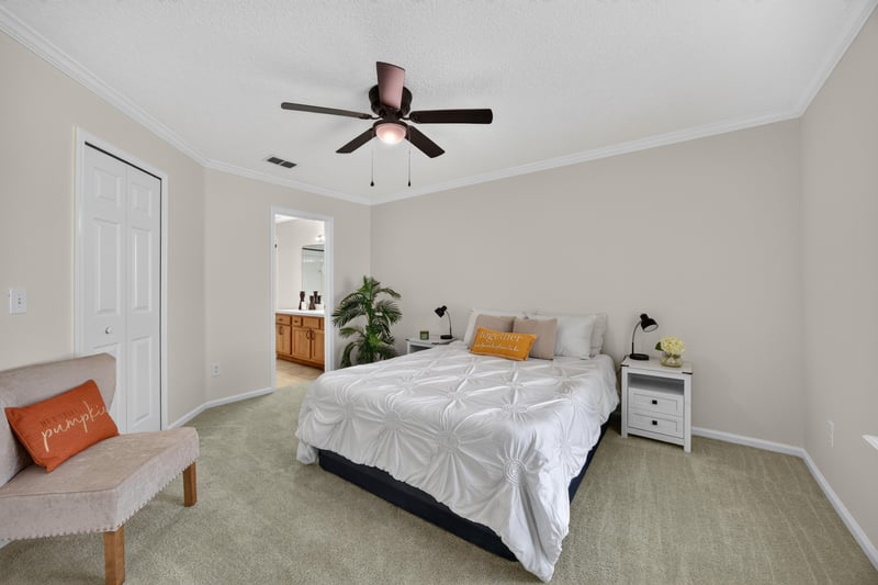 Primary bedroom with bed and nightstand at 605 N Covered Bridge Rd, Jacksonville, FL