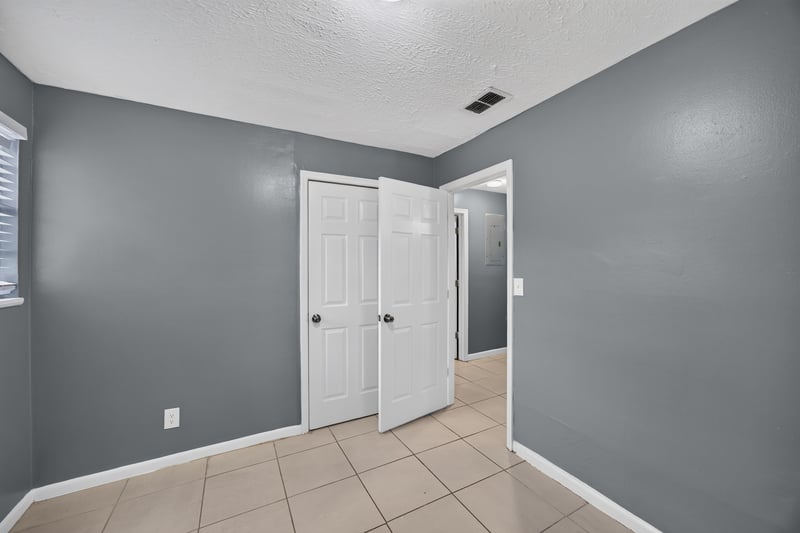 Hallway with closet doors at 6745 Jack Horner Ln, Jacksonville, FL 32210