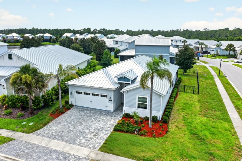 Angled drone view of the front yard and corner at 91 Tilloo Ct, St. Johns, FL