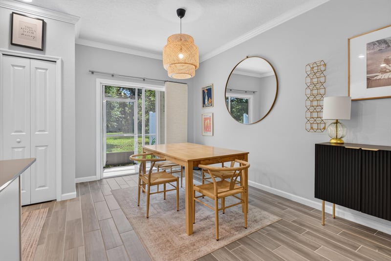 Dining table near sliding glass door at 1186 Beach Dune Dr, Jacksonville, FL 32233