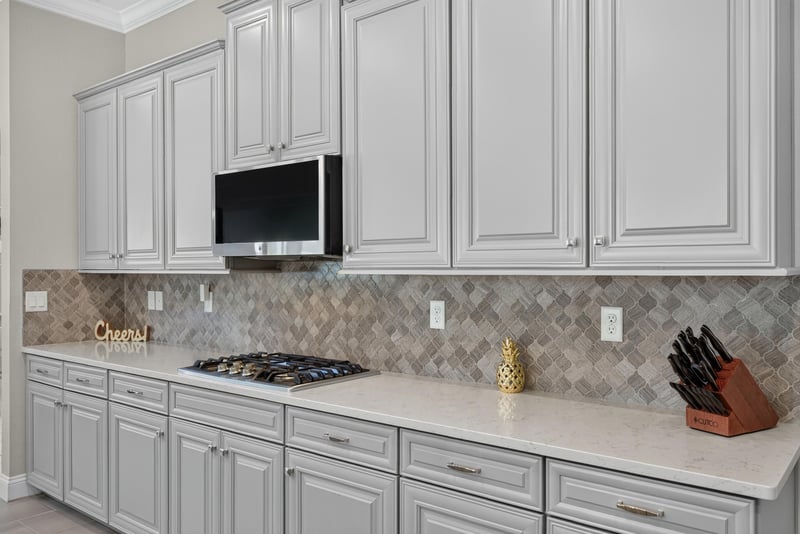 Kitchen cooktop and backsplash detail at 22 Azura Point