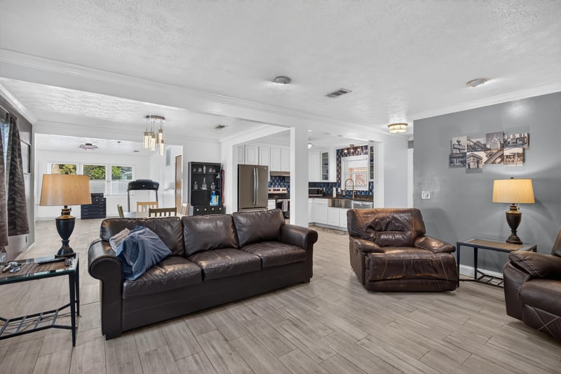 Open living and dining area with wood flooring at 6059 Karen St, Jacksonville, FL 32244