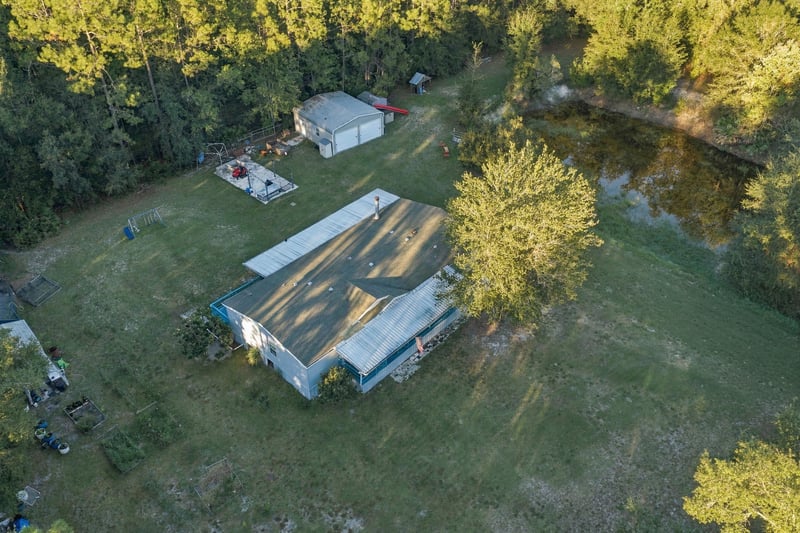 Aerial view of home among trees, photographed by Megapixeler on Secret Cove Rd, Middleburg, FL