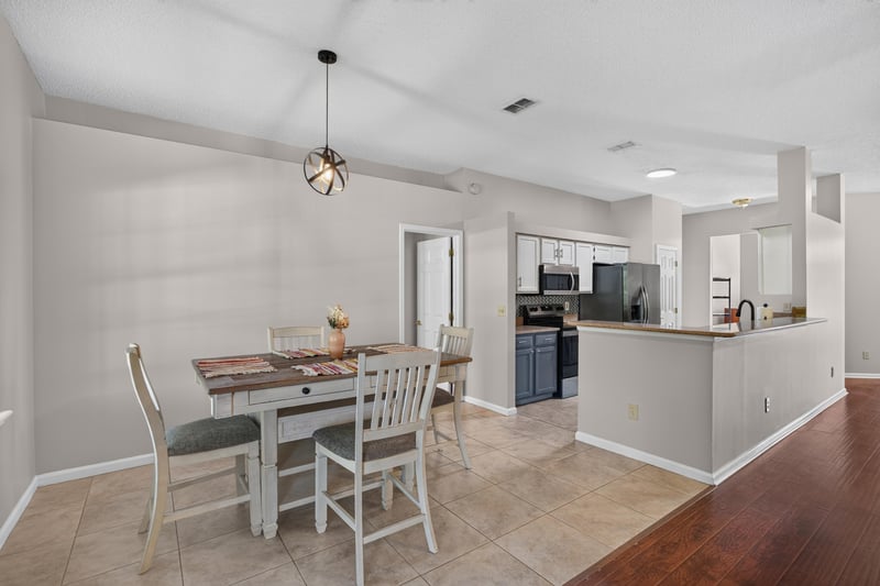 Dining area with view into kitchen at 11828 Heather Grove Ln, Jacksonville, FL