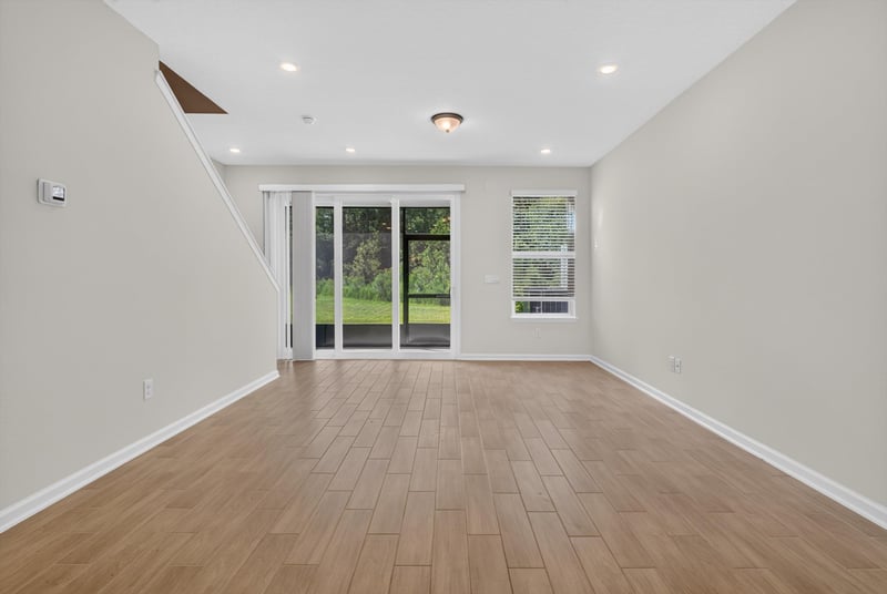 Living room with sliding glass door at 39 Mellowood Ln, St. Augustine, FL 32092