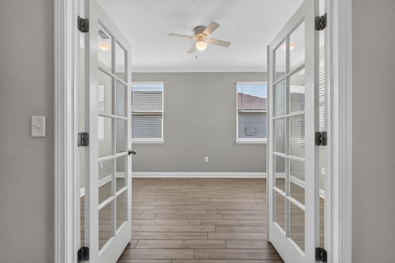 French doors opening to flex room with wood floor at 2580 Cold Stream Ln, Green Cove Springs, FL 32043