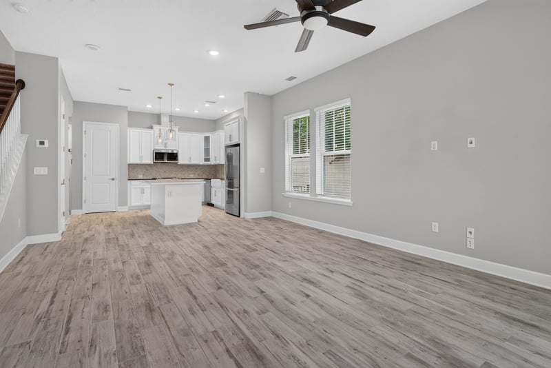 Open living and kitchen area with island at 7446 Loggerhead Ct, Jacksonville, FL 32256