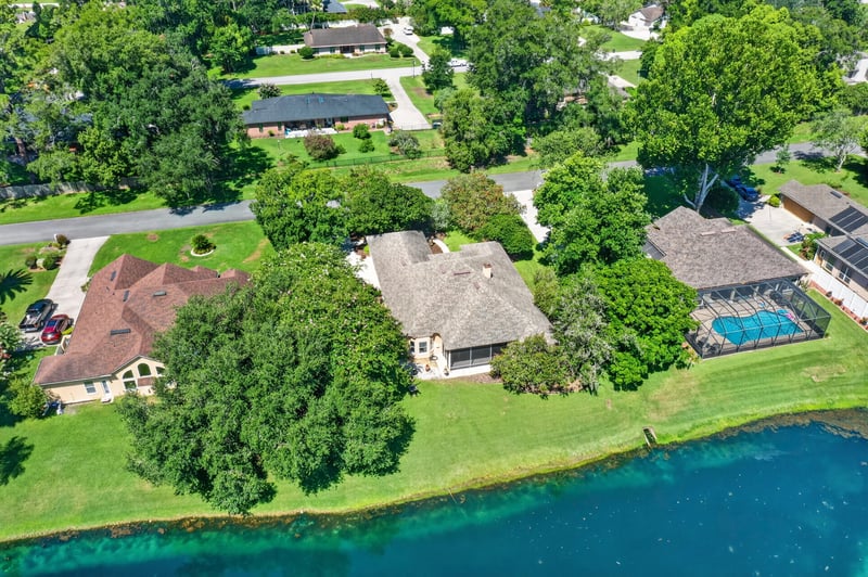 Aerial of the pond lined with homes in Jacksonville, FL