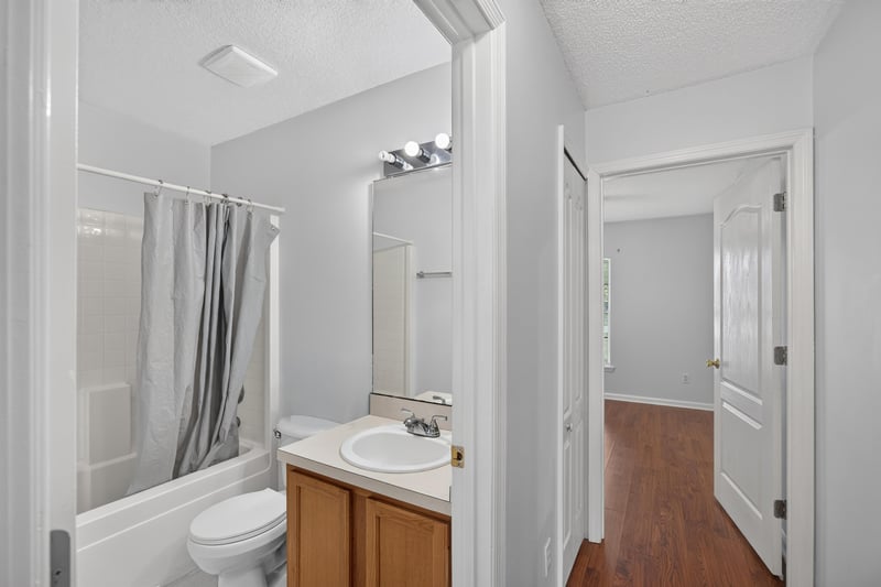 Bathroom with shower curtain and vanity at 9691 Nelson Forks Dr, Jacksonville, FL 32222