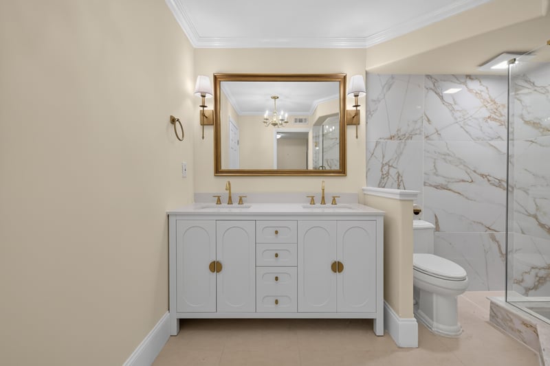 Primary bathroom vanity with mirror and toilet at 1301 1st St S