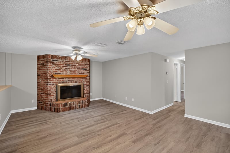 Living room fireplace and ceiling fan, second angle at 1435 Undine Ave, Jacksonville, FL