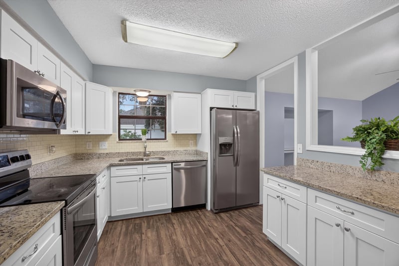 Kitchen with cabinets and stainless appliances at 12344 Cormorant Ct, Jacksonville, FL