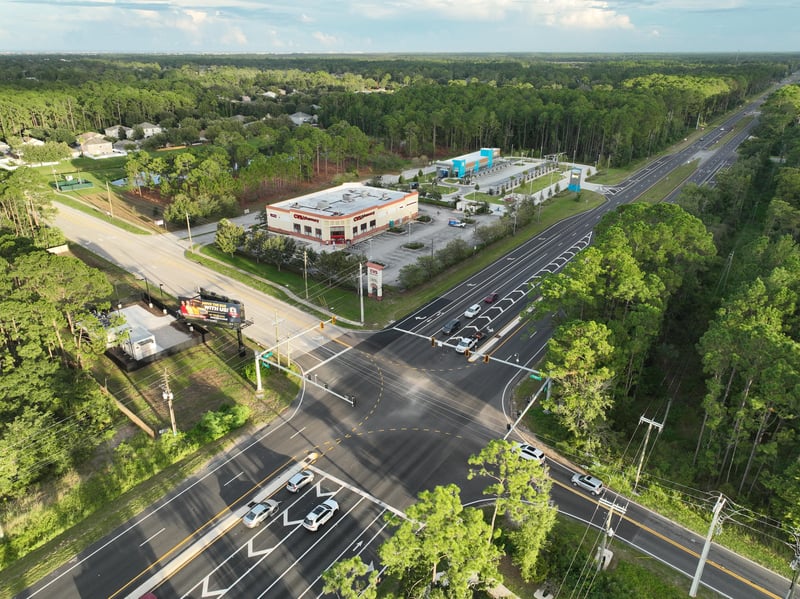 Low aerial view of the commercial building above the US-1 intersection at 4900 US-1, St. Augustine, FL 32086
