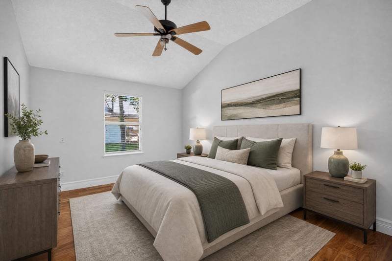 Bedroom staged with bed and dresser at 11675 Magnolia Estates Rd, Jacksonville, FL 32223