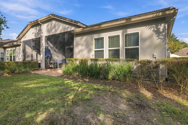 Backyard and rear exterior, photographed by Megapixeler on Lucena Ln, Jacksonville, FL