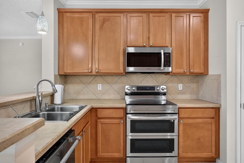 Kitchen with double wall oven and tile backsplash at 1493 Greyfield Dr, St. Augustine, FL 32092