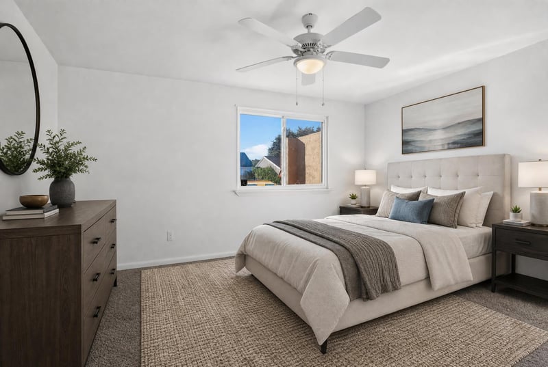 Bedroom with bed and ceiling fan, virtually staged at 8177 Virgo St, Jacksonville, FL 32216