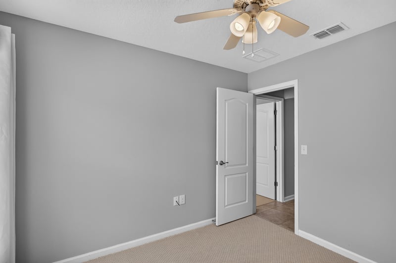 Hallway with closet door and ceiling fan at 85 Amia Dr, St. Augustine, FL 32086