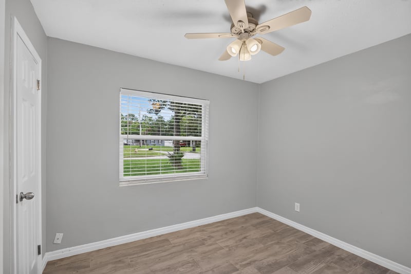 Bedroom, wood-look floors and window at 2256 Inwood Cir S, Jacksonville, FL