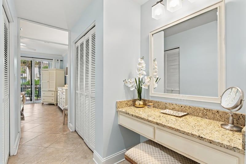 Hallway with linen closet and mirror at 805 Spinnakers Reach Dr, Ponte Vedra Beach, FL 32082