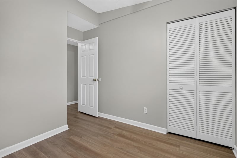 Bedroom with window and wood-look flooring at 255 Woodside Dr, Orange Park, FL 32073