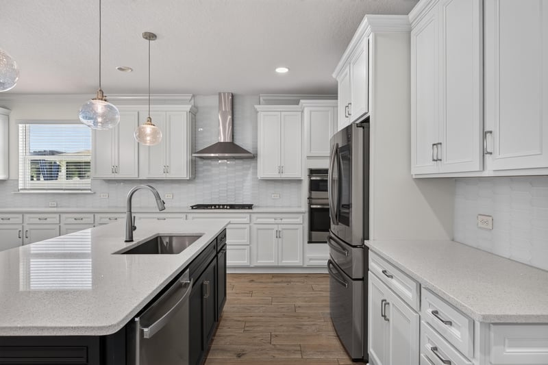 Kitchen with navy island and stainless range at 855 Flach Dr, St. Johns, FL
