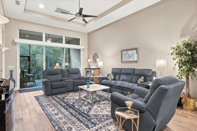 Living room with wall of windows, photographed by Megapixeler on Lucena Ln, Jacksonville, FL