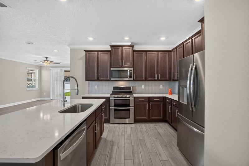 Kitchen island with pendant lighting at 331 Millerstone Dr, St. Augustine, FL 32092