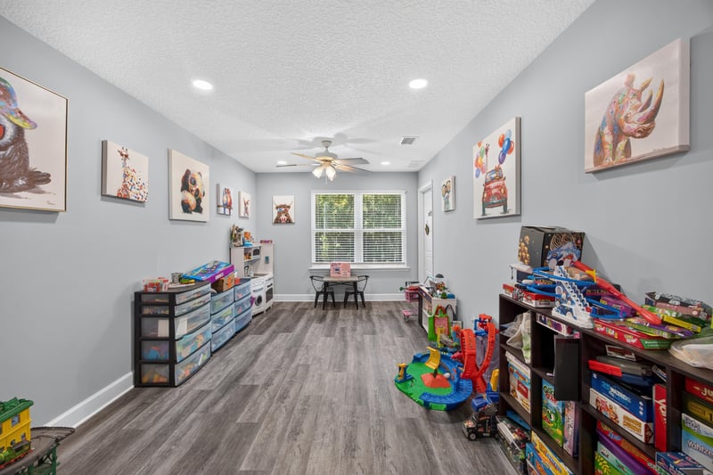 Playroom with toy storage and ceiling fan at 2817 Camel Cir, Middleburg, FL