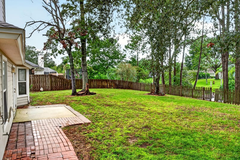Backyard patio with brick path at 12949 Chets Creek Dr S, Jacksonville, FL 32224