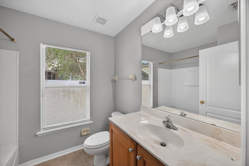 Bathroom with vanity and mirror at 635 Wakeview Dr, Orange Park, FL 32065