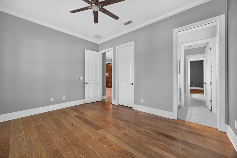 Bedroom with wood floor and closet door at 186 Freshwater Dr