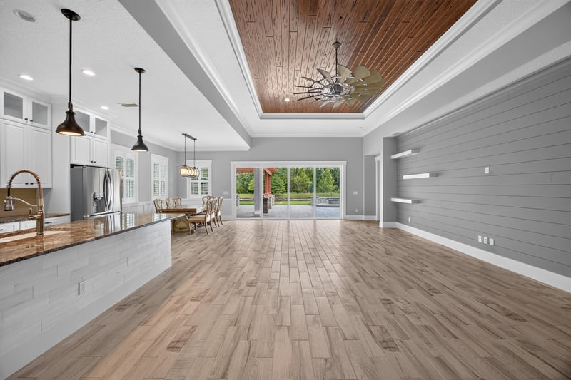 Great room with vaulted wood ceiling and sliders to the patio at 186 Freshwater Dr