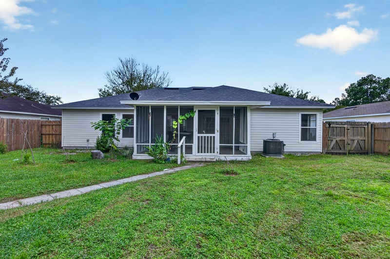Screened porch with game table at 9691 Nelson Forks Dr, Jacksonville, FL 32222