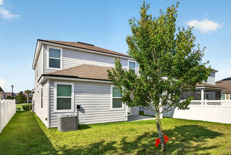 Backyard with young tree and lawn at 331 Millerstone Dr, St. Augustine, FL 32092
