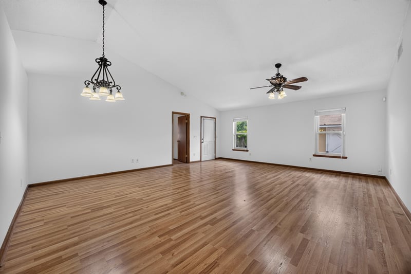 Unfurnished living room with wood floors and ceiling fan at 2460 San Sago Ln, Jacksonville, FL