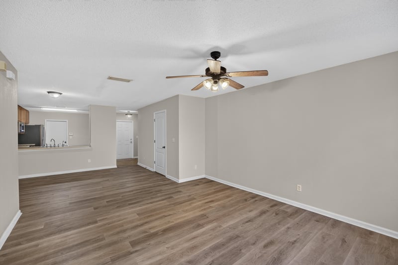 Open living space with ceiling fan at 7723 Playschool Ln, Jacksonville, FL