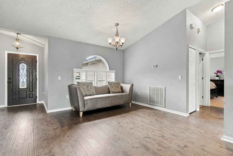 Living room near front door with sofa at 11197 Illford Dr