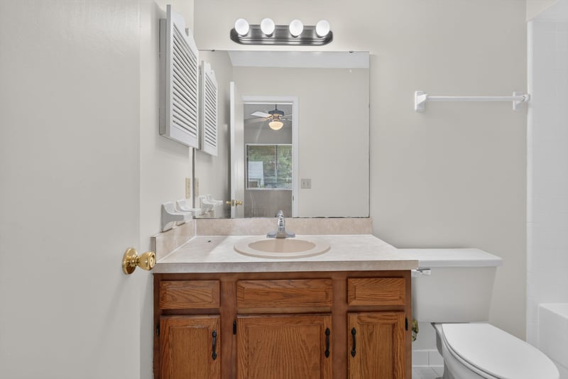 Bathroom vanity with mirror at 1445 Classic Oak Rd W, Jacksonville, FL