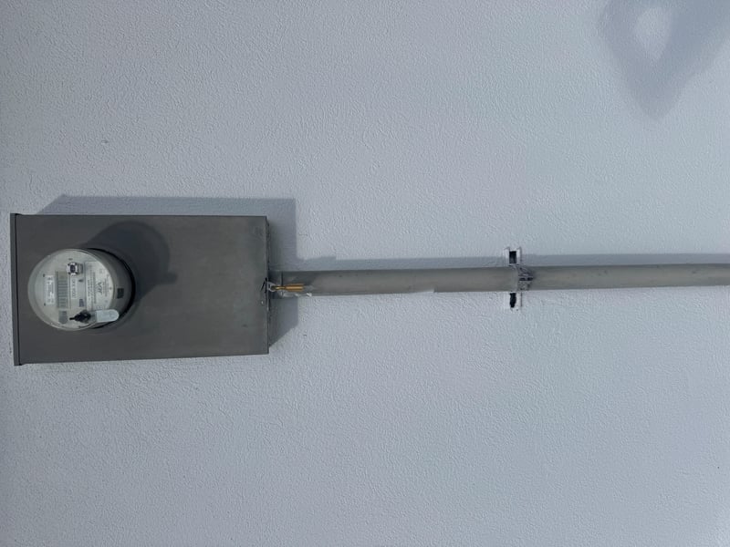 Electric meter mounted on exterior conduit at 11700 New Kings Rd, Jacksonville, FL 32219