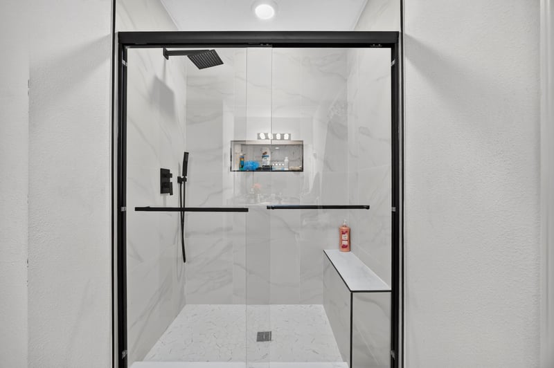 Primary bathroom glass-enclosed shower at 518 Matecumbe Ct, Macclenny, FL