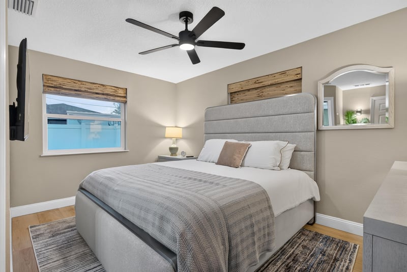 Bedroom with ceiling fan and window at 1525 8th St N, Jacksonville Beach, FL