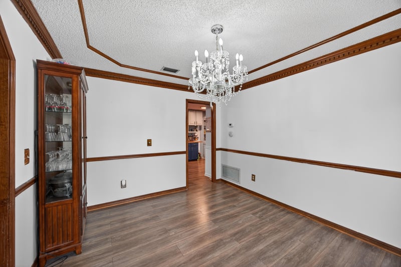 Dining room with china cabinet and crown molding at 981 Marble Ridge Dr, Orange Park, FL 32065