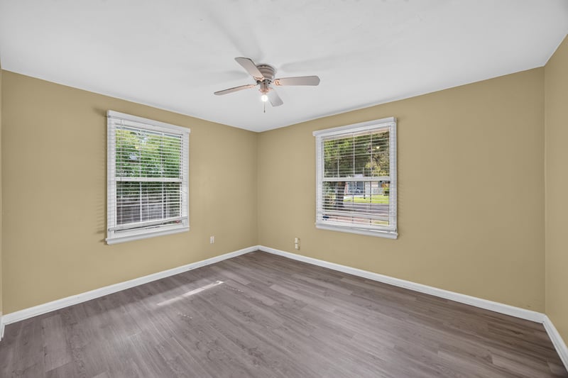 Bedroom corner with windows and wood-look floors at 2841 Ernest St, Jacksonville, FL 32205